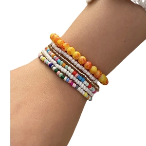 Bohemian multilayer seed bead bracelet set in assorted colors worn on wrist