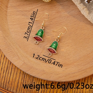 Detailed view of enamel Christmas bell earrings with dimensions 3.7cm height on a wood tray