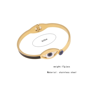 Detail view of golden stainless steel evil eye bangle with 6x5cm size specifications