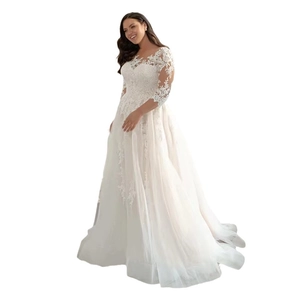Elegant off-shoulder white lace wedding dress with long sleeves and a flowing tulle skirt