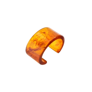 Bold chunky amber acrylic resin cuff bracelet with artistic dark marble swirl pattern