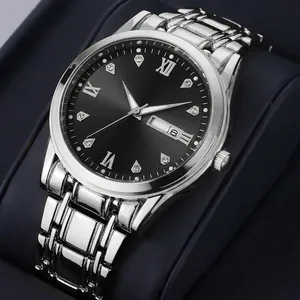 Detail of ORUSS men's silver stainless steel watch with black textured dial and calendar