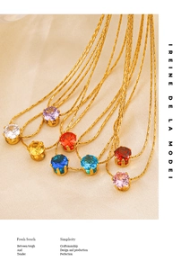 Close-up of colorful round cut zircon pendants with gold plated four-claw setting