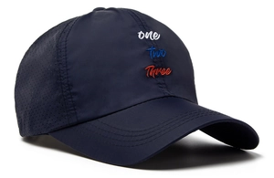 Detail of navy quick-dry baseball cap featuring breathable side laser holes and 3-color embroidery