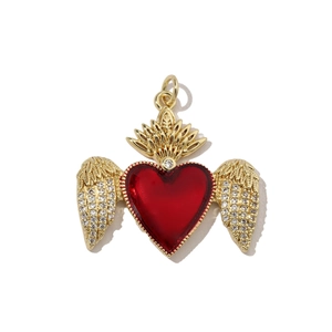 Detailed view of red enamel heart pendant with golden wings and sparkling zircon pavé