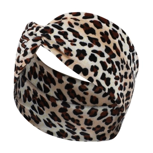 Macro detail of leopard print velvet headband featuring a stylish twist knot design