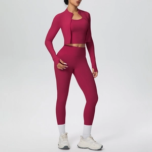 Detail of berry yoga set jacket featuring thumbhole cuffs and stretchy athletic fabric