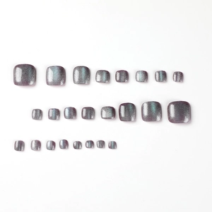 Cat eye glitter press-on toenails in purple-grey finish with multiple sizes on white background