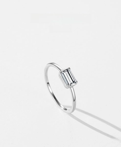 Macro shot of S925 sterling silver ring featuring a single emerald cut cubic zirconia stone