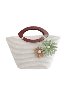 Handmade cream cotton rope tote bag with wooden handles and woven flower decorations