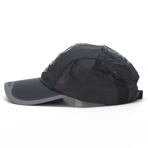 Detail view of quick-dry baseball cap with mesh side panels and SPORT embroidery