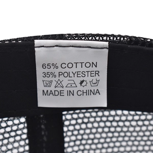 Detail view of the wash care label showing 65% cotton and 35% polyester fabric mix