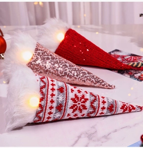 Three glowing sequined Christmas gnomes with LED lights and knitted holiday hats decoration