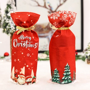 Christmas wine bottle covers with Santa and snowman motifs featuring golden ribbon ties