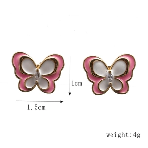 Detailed view of 1.5cm pink and white enamel butterfly earrings with dimensions and weight