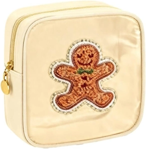 Detailed close-up of a gingerbread man embroidery on a beige chenille makeup bag