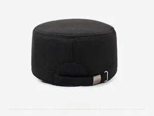 Detail view of the black patrol cap back featuring an adjustable metal buckle and texture