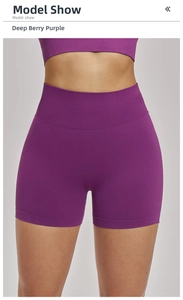 Close-up of high-waist seamless yoga shorts in deep berry purple with elastic waistband