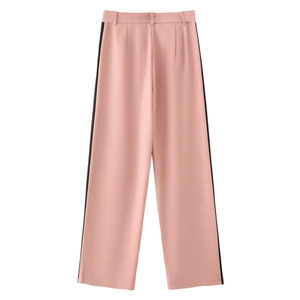 Pink wide-leg trousers featuring black side stripes and a vintage sporty design