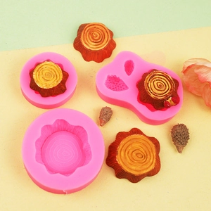 Detail of tree stump silicone molds showing realistic wood texture for DIY crafts