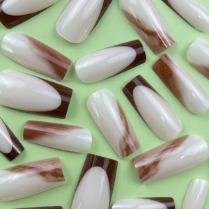 French marble pattern press-on nails in coffee brown and cream white long coffin shape