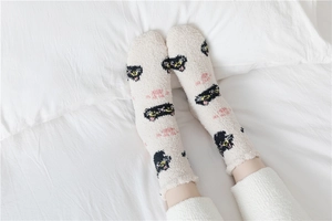 Detail of soft thick coral fleece winter socks with cute cartoon cat face pattern