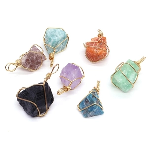 Handmade wire-wrapped natural crystal pendants in various irregular healing stones