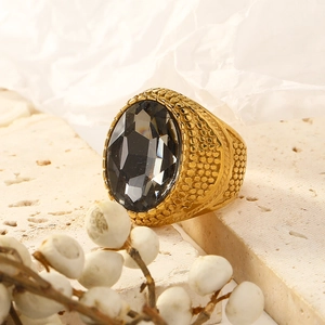 Punk vintage gold plated stainless steel ring with a large grey oval gemstone