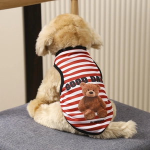 Detail of red and white striped puppy vest with a teddy bear print and soft cotton texture