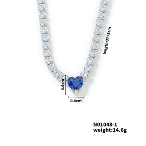 Detail view of silver tennis chain with blue heart pendant and specific measurements