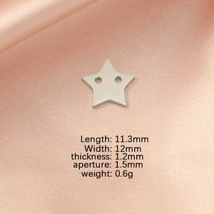 Macro shot of silver stainless steel star charm with detailed dimension specifications