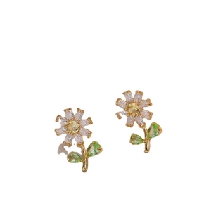 Floral stud earrings with colorful cubic zirconia in gold plating on white background