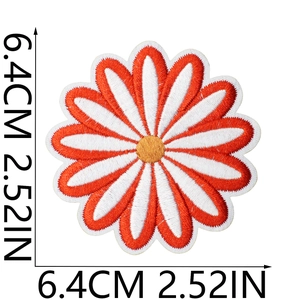 Detailed embroidery texture of orange daisy flower patch with size measurement 6.4cm