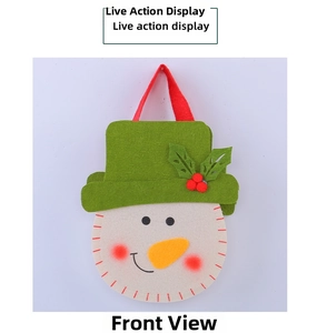 Detailed view of handmade snowman Christmas felt gift bag with festive green hat and red ribbon