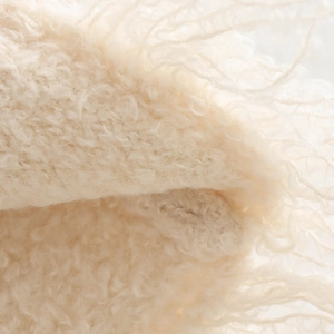 Sweet cream knit set featuring a fuzzy texture cardigan and fringed skirt details