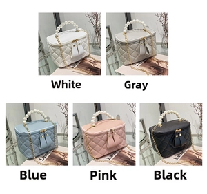 Quilted mini handbag detail showing five colors with pearl handle and golden chain