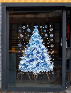 Detail of laser iridescent blue Christmas tree window sticker with snowflakes on glass