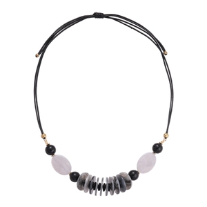 Black leather cord necklace with acrylic oval beads and geometric discs in boho style