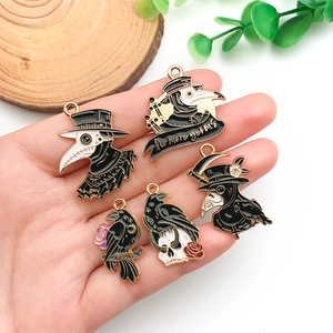 Detailed enamel charms featuring plague doctor and raven motifs for DIY jewelry making