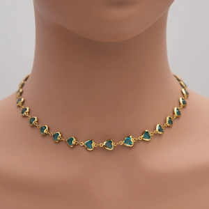 Detailed view of heart-shaped blue glass necklace with gold-plated titanium steel chain