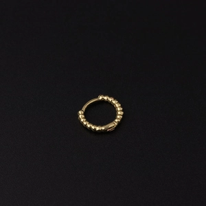 Minimalist gold beaded huggie hoop earring with textured metallic spheres for women