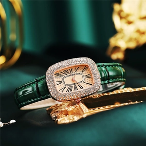 Luxury green leather watch set with gold diamond bezel and matching chain bracelet