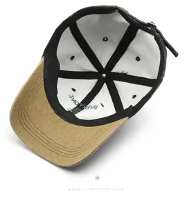 Detail view of cotton baseball cap interior showing six-panel stitching and metal buckle