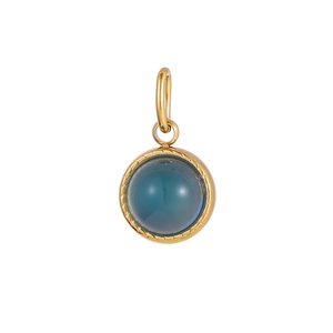 Macro shot of dark blue gemstone pendant in gold plated frame with woven textures