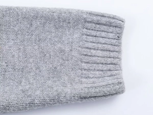 Close-up of ribbed knit cuffs on grey star hooded cardigan showing premium soft texture