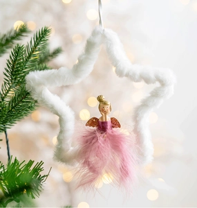 Detail of Christmas tree ornament with plush star and fairy in pink feather dress