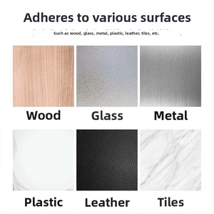 Detail showing adhesive cable clip compatibility with wood, glass, metal, and leather surfaces