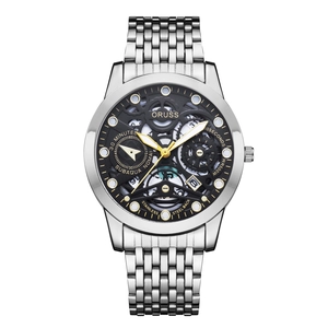 Macro detail of skeleton quartz watch dial with silver stainless steel band and roman numerals
