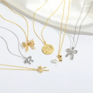French vintage bow pendant necklaces in gold and silver with rhinestones and pearls