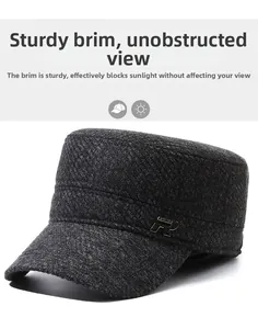Detail of grey cadet cap featuring stiff brim and decorative metal R logo plaque